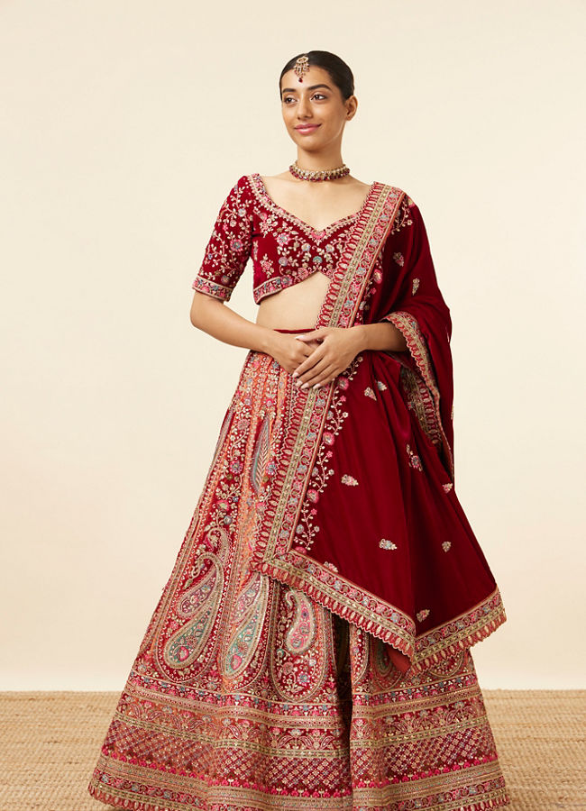 alt message - Mohey Women Mustard Red Embroidered Bridal Lehenga image number 0